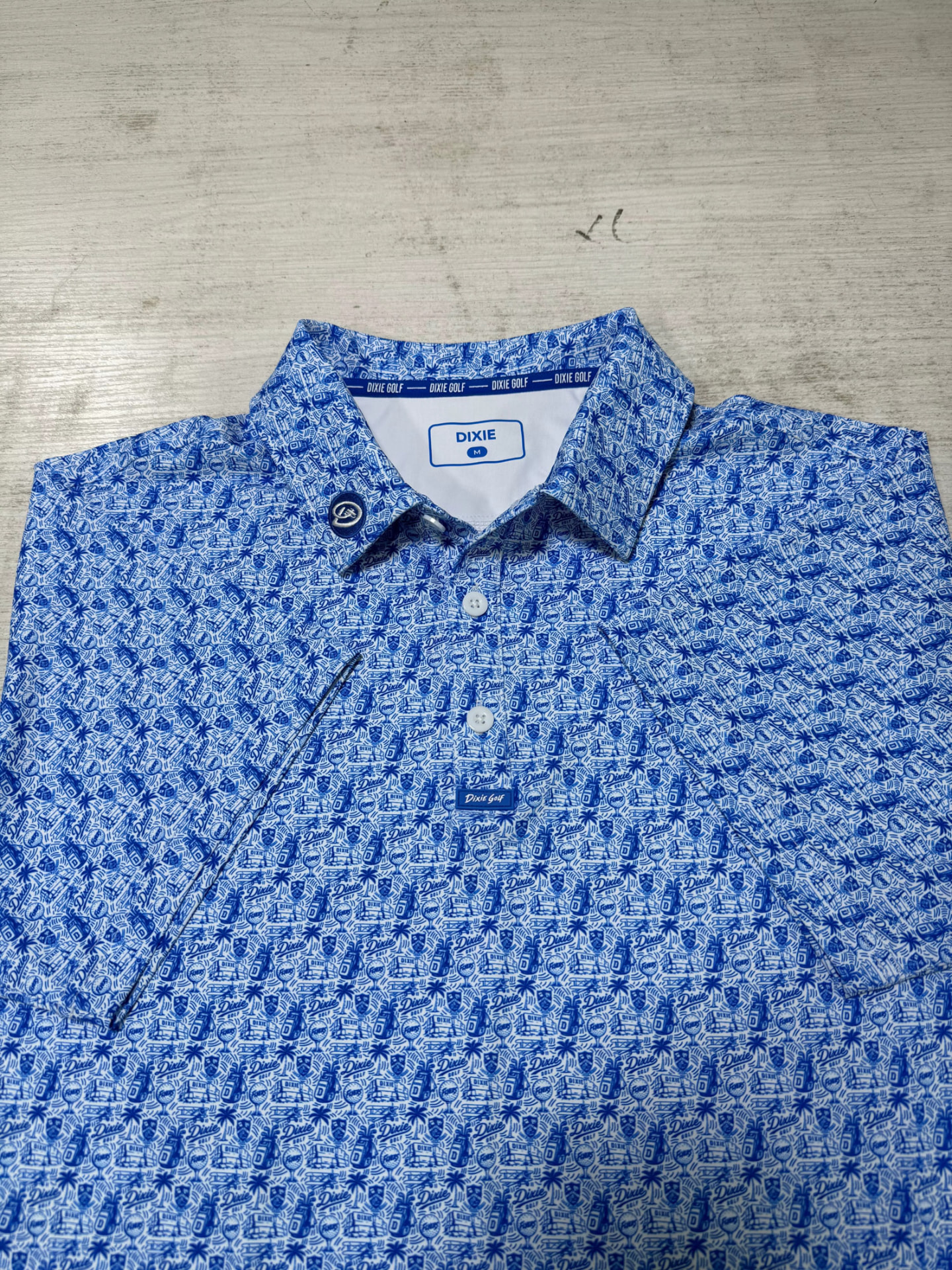 Close-up of a custom printed golf polo collar and placket